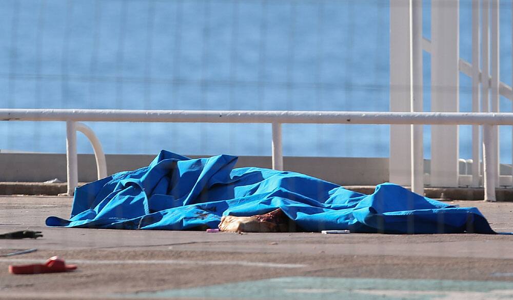 Bodies of victims covered by sheets