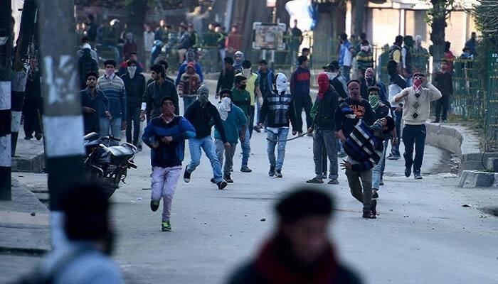 Kashmir remains tense with sporadic violence; one protestor killed, three militants gunned down
