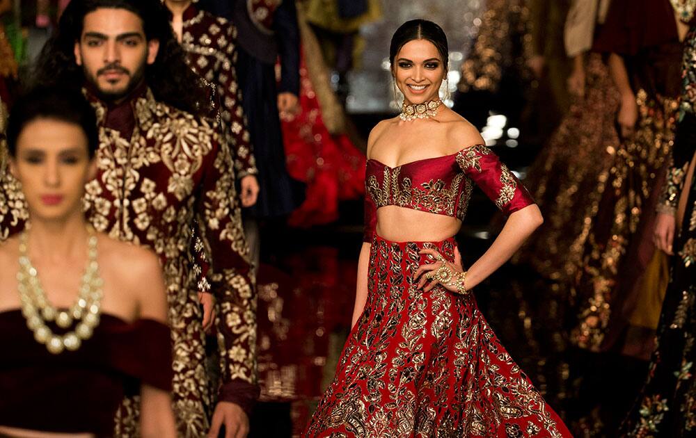 Bollywood actress Deepika Padukone displays a creation by India designer Manish Malhotra