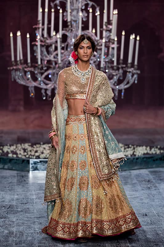 A model displays a design by Indian designer Tarun Tahiliani at the India Couture Week