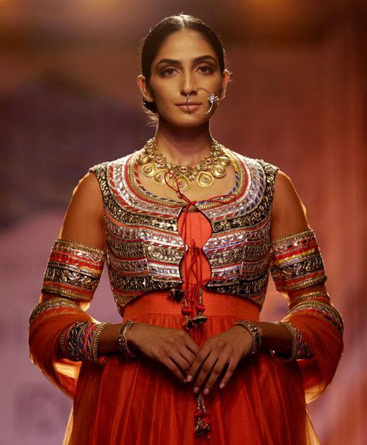 A model displays a creation by designer Reynu Taandon