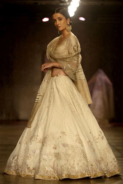 A model displays a creation by designers Rimple & Harpreet Narula