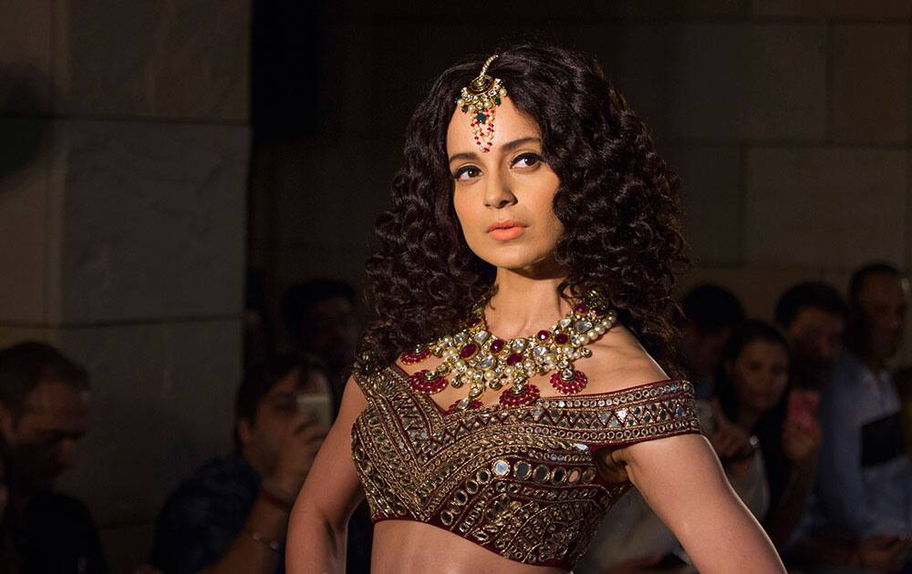 Kangana Ranaut displays a creation by Indian designer Manav Gangwani at the India Couture Week Kangana Ranaut displays a creation by Indian designer Manav Gangwani at the India Couture Week