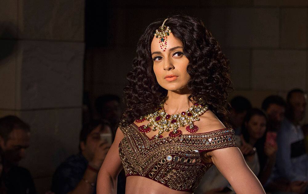 Kangana Ranaut displays a creation by Manav Gangwani at the India Couture Week