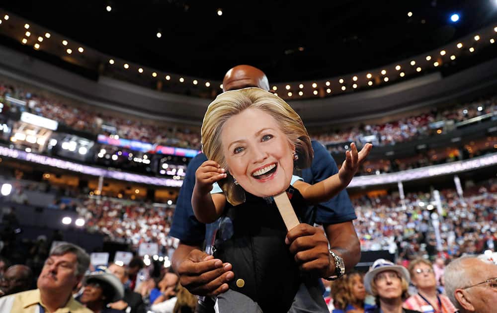 Ethan Jennings grabs a cardboard cutout of the face of Democratic Presidential candidate Hillary Clinton Ethan Jennings grabs a cardboard cutout of the face of Democratic Presidential candidate Hillary Clinton