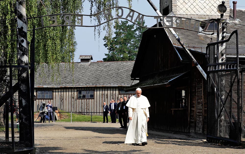 Pope Francis walks through the gate of the former Nazi German death camp of Auschwitz in Oswiecim, Poland Pope Francis walks through the gate of the former Nazi German death camp of Auschwitz in Oswiecim, Poland