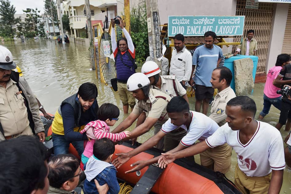 personnel rescuing the people from a flood personnel rescuing the people from a flood