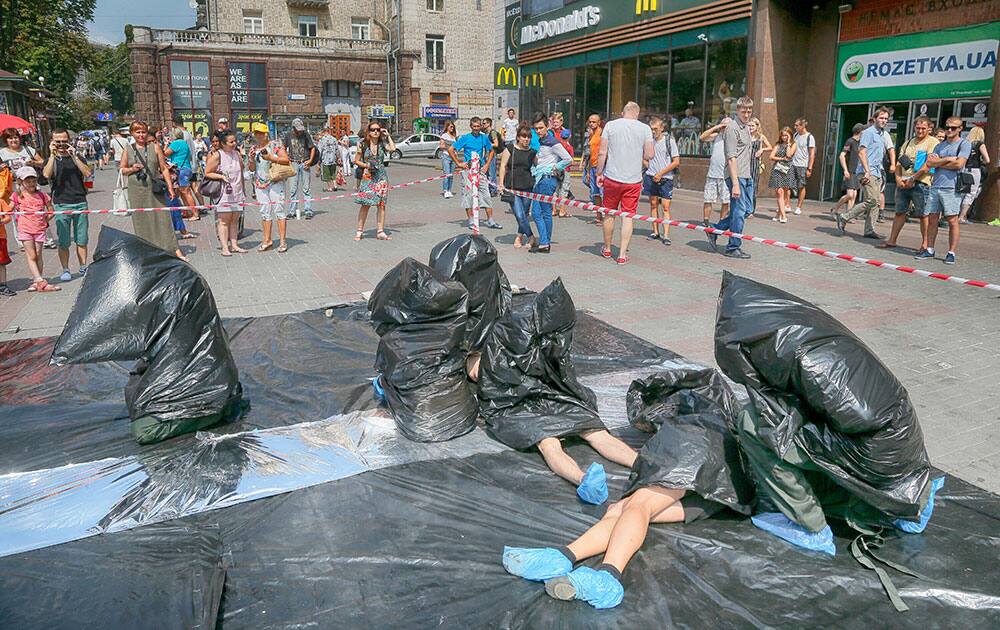 Young people perform a symbolic tableau to attract public attention to the problem of human trafficking Young people perform a symbolic tableau to attract public attention to the problem of human trafficking