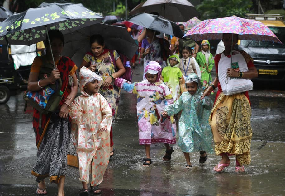 children wearing raincoats