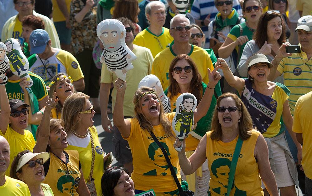 Demonstrators shout slogans against suspended Brazil's President Dilma Rousseff