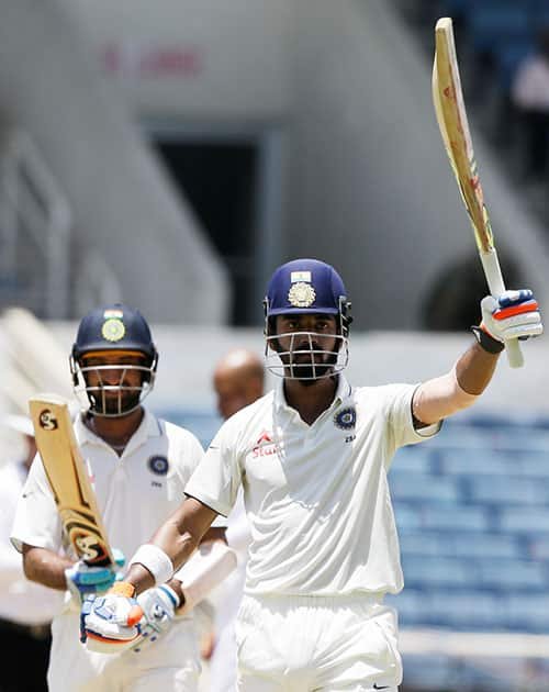 Lokesh Rahul celebrates after he scored a 