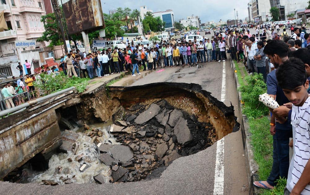 People gather collapse of a portion of Gopalpura bypass road