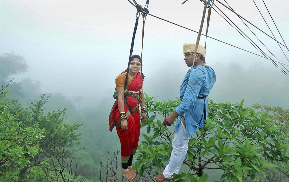 Jaydeep Jadhav and his bride Reshma Patil onto nylon-fibre ropes during their unique wedding ceremony