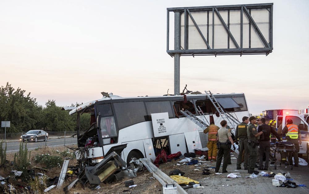 Rescue crews work at the scene of a charter bus crash