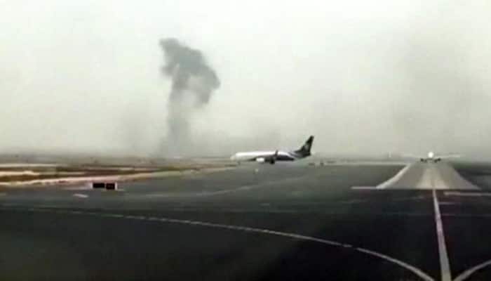 Emirates plane with 300 people on board crash-lands in Dubai, firefighter killed