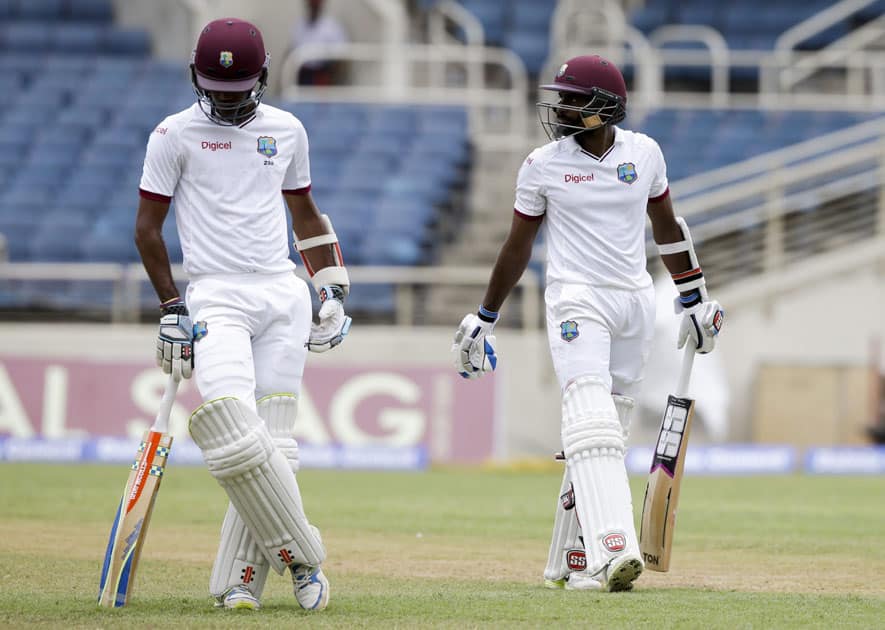 Kraigg Brathwaite on his way to the pavilion after being bowled Ishant Sharma