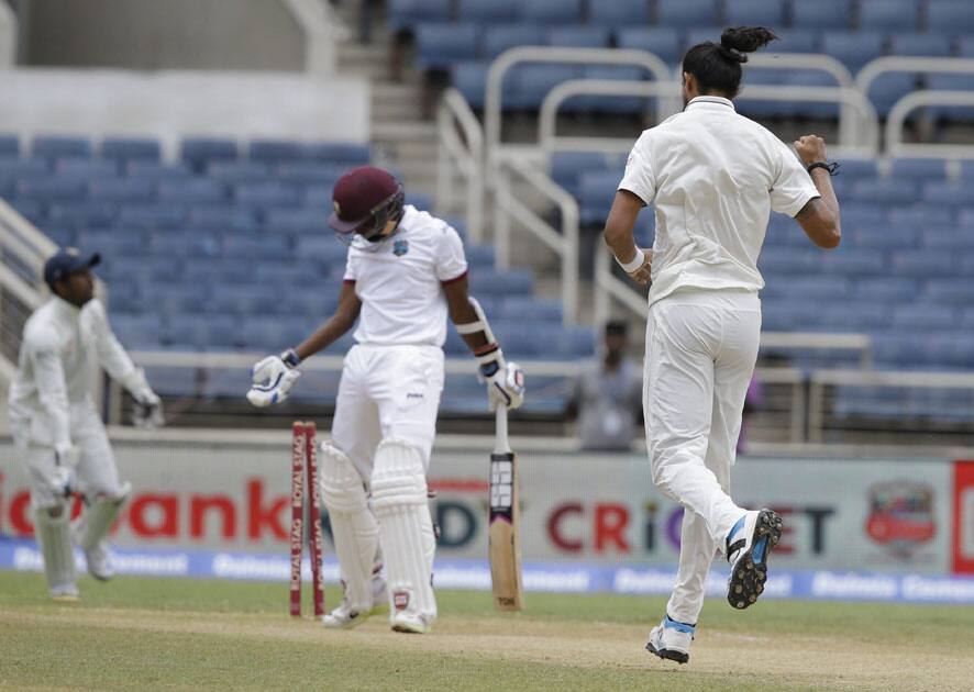 Indias bowler Ishant Sharma right celebrates