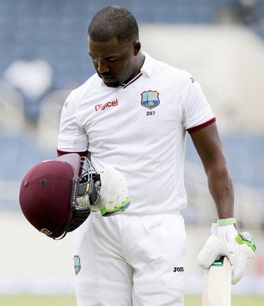 West Indies batsman Darren Bravo leaves the field