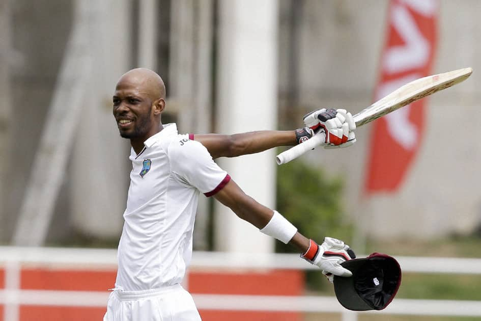 Roston Chase celebrates after he scored a century