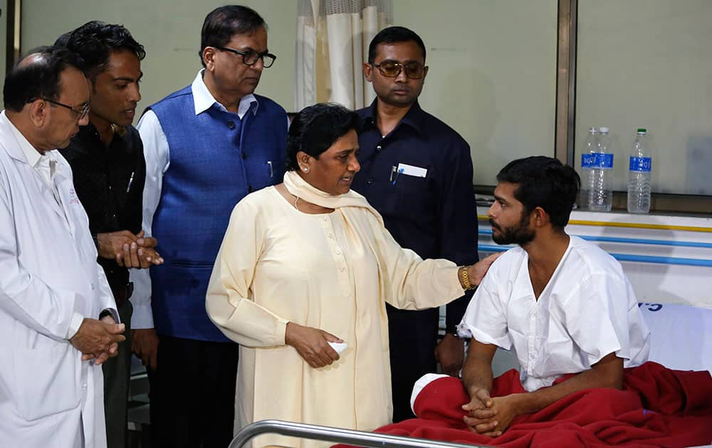 BSP chief Mayawati talks to Ramesh Sarvaiya, a low-caste Dalit victim