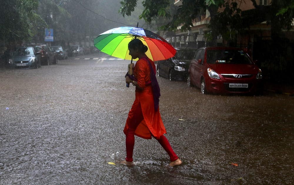 A woman holds an umbrella