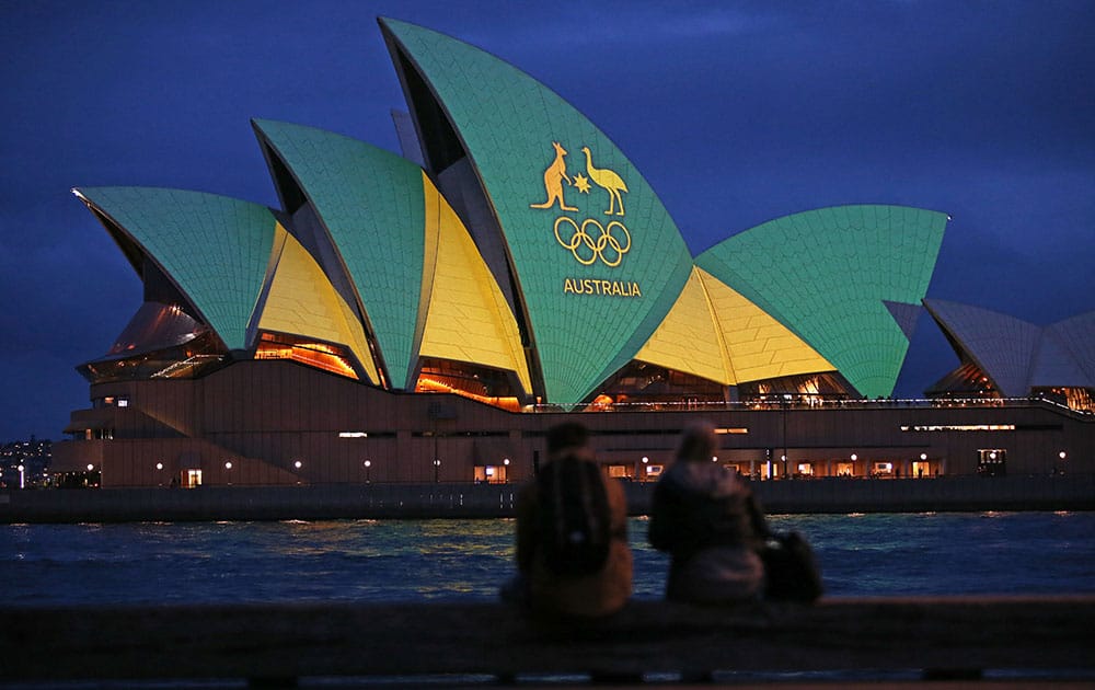 Sydney Opera House illuminated with the green and gold colors of the Australian Olympic team