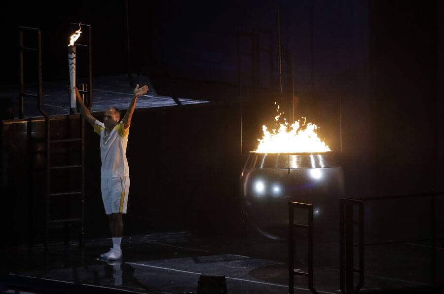 Vanderlei de Lima lights the Olympic flame