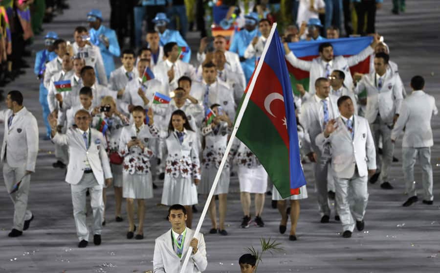 Teymur Mammadov carries the flag of Azerbaijan