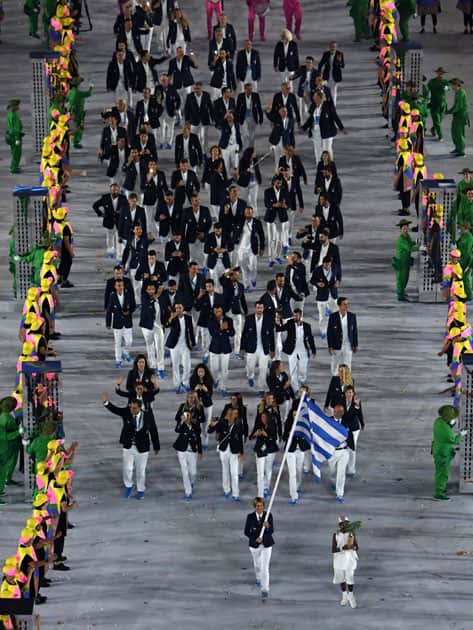 Greece's Sofia Bekatorou carries the flag