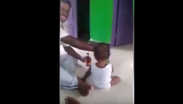 SHOCKING: Chennai dad forces baby to drink beer while mom records on phone – See Pic