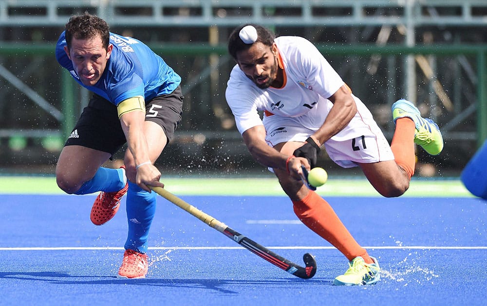 India`s Akasdeep and Argentinas Captain Pedro Ibarra during the Qualifying round match against Argentina