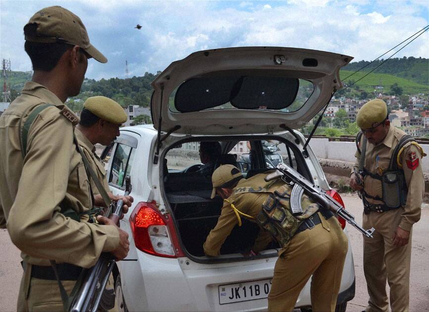 Security personnel checking a vehcile