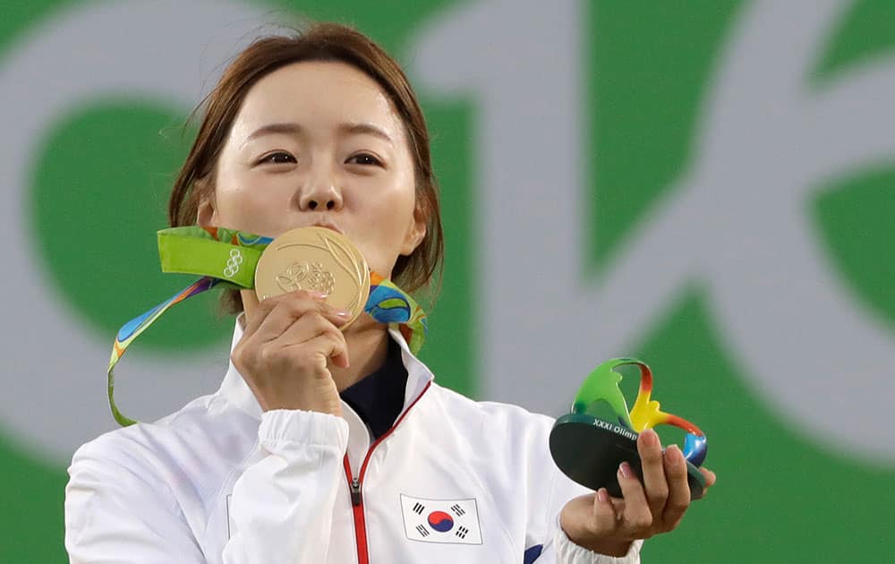 South Korea's Chang Hye-jin, kisses her gold medal at the awards ceremony of the women's individual archery competition