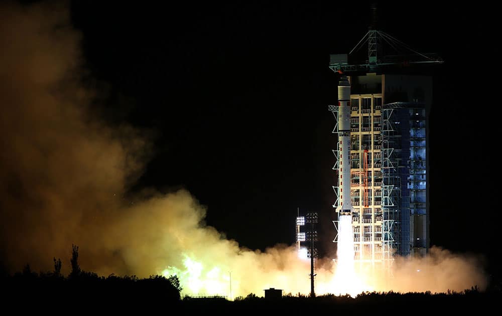 a Long March-2D rocket carrying the world's first quantum satellite lifts off from the Jiuquan Satellite Launch Center in Jiuquan, northwestern China's Gansu Province