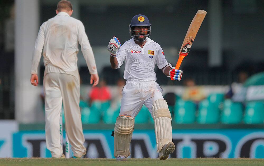 Sri Lanka's Kaushal Silva celebrates scoring a hundred against Australia