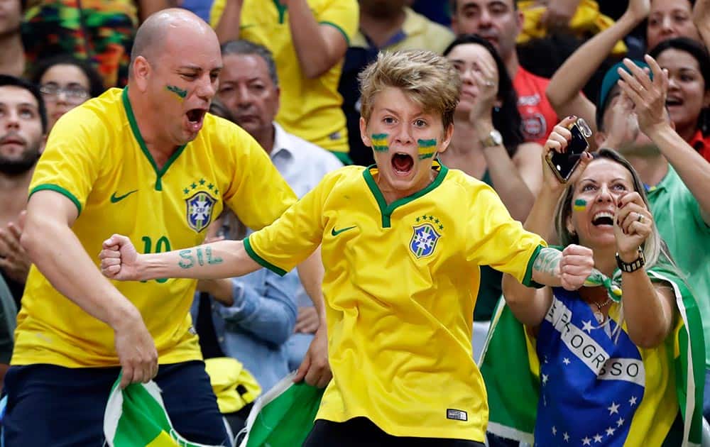 Fans react during Brazil's loss to China