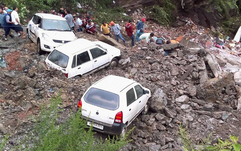 Rescue operation in progress after a three storey building collapsed at Hatkoti, 104 KMs away from Shimla