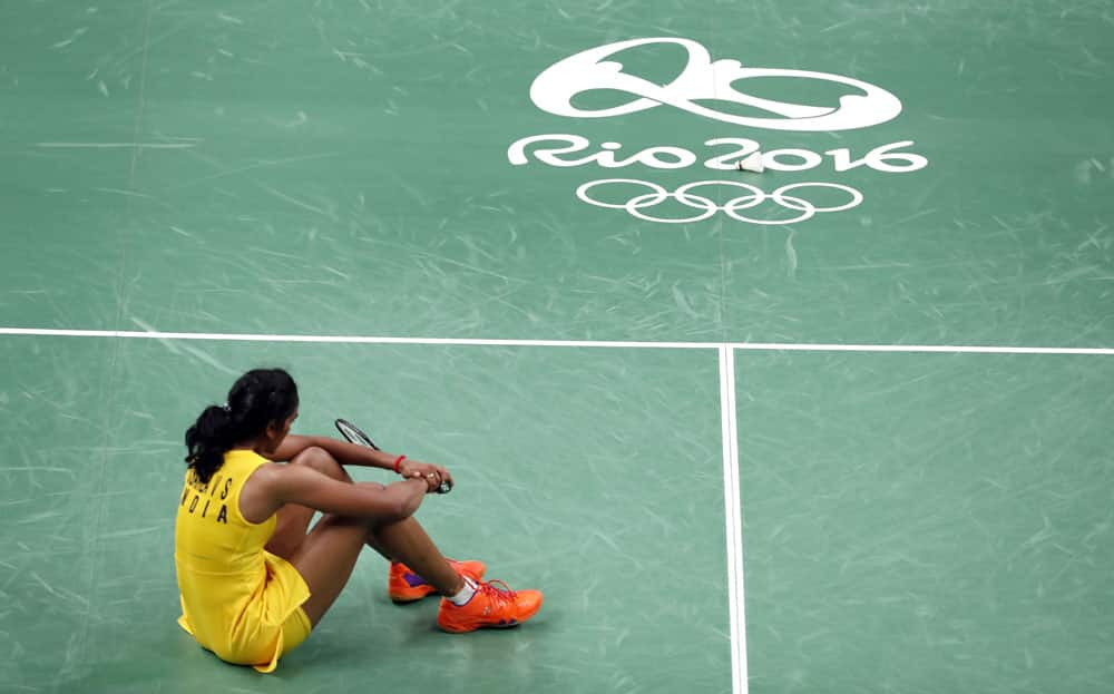 India's V. Sindhu Pusarla sits on the court