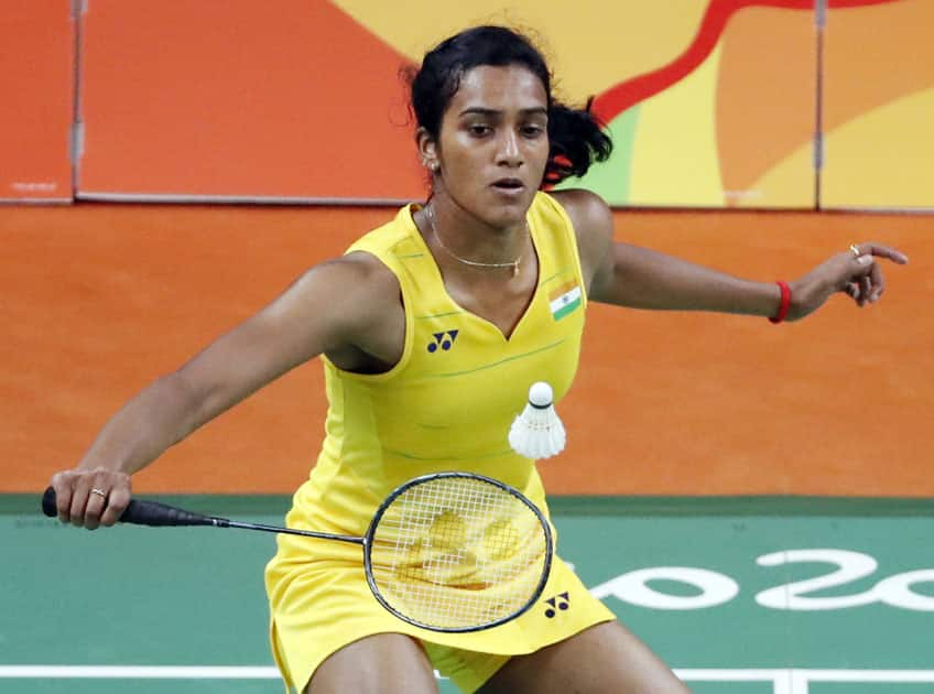 India's V. Sindhu Pusarla returns a shot to Carolina Marin