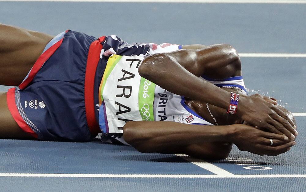 Mo Farah celebrates after winning the gold medal