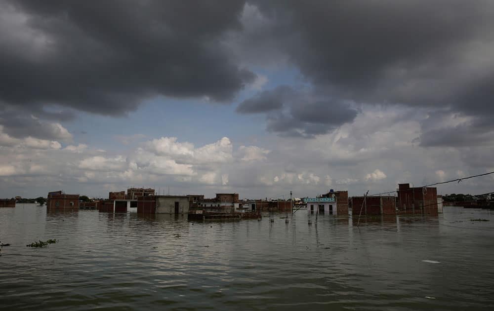 Houses are seen partially submerged following floods in the River Ganges in Allahabad