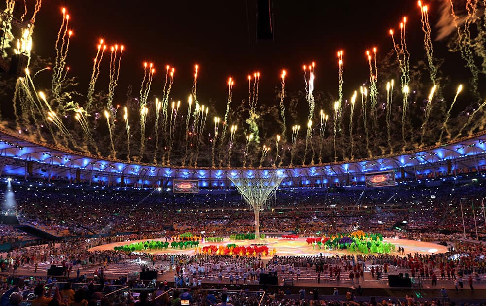 Fireworks goes off after the Olympic flame was extinguished during the closing ceremony