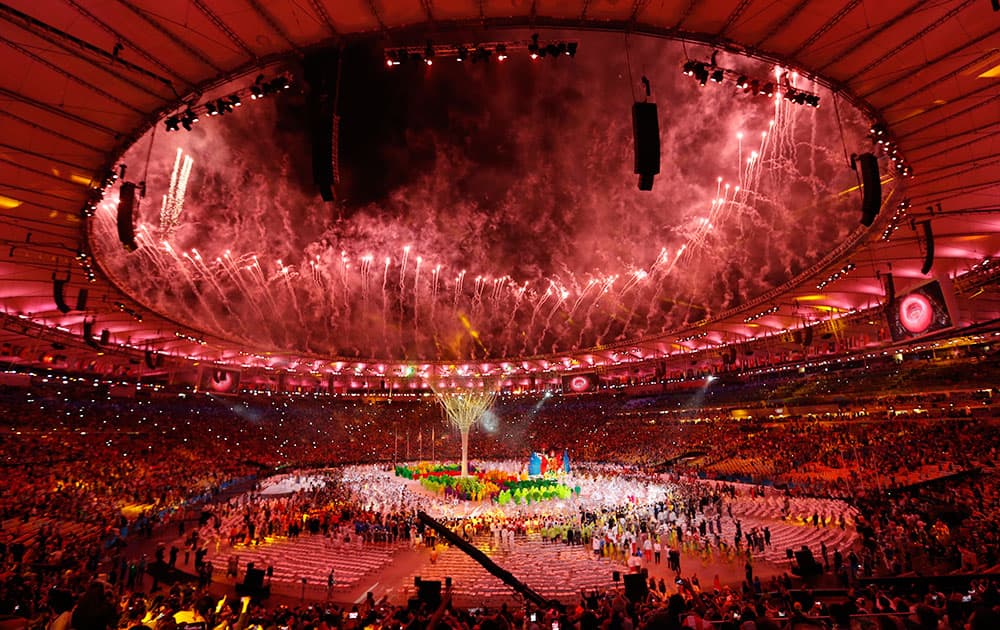 Pyrotechnics explode during the closing ceremony for the Summer Olympic