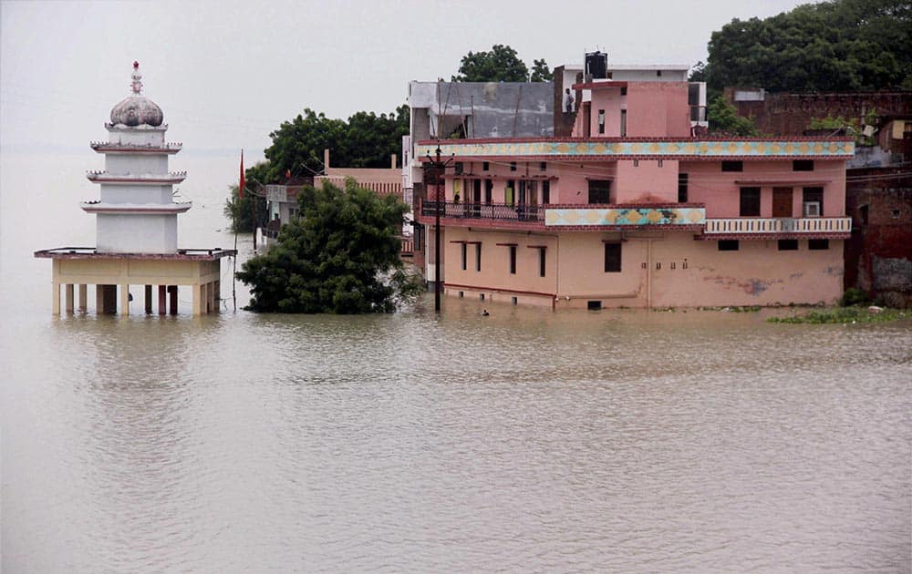 A view of submurged houses in water of River Ganga and Yamuna