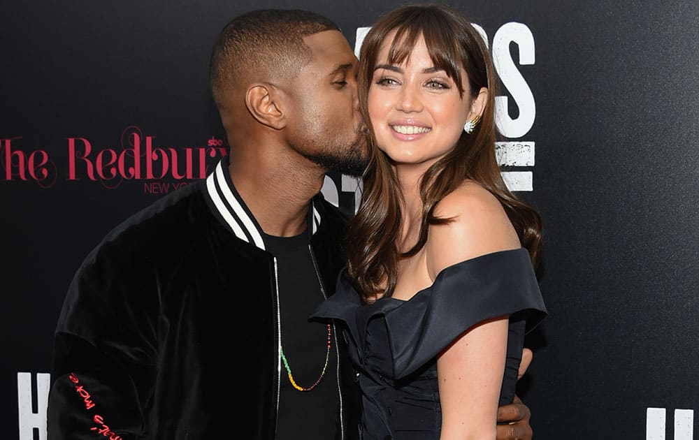 Actors Usher Raymond and Ana de Armas attend the US premiere of 
