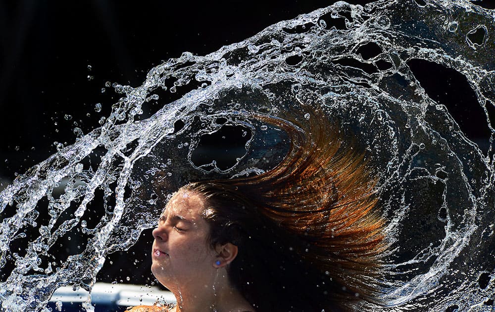 Maggie Domski, 13, makes a splash in her swimming pool  in Blakely, Pa. 
