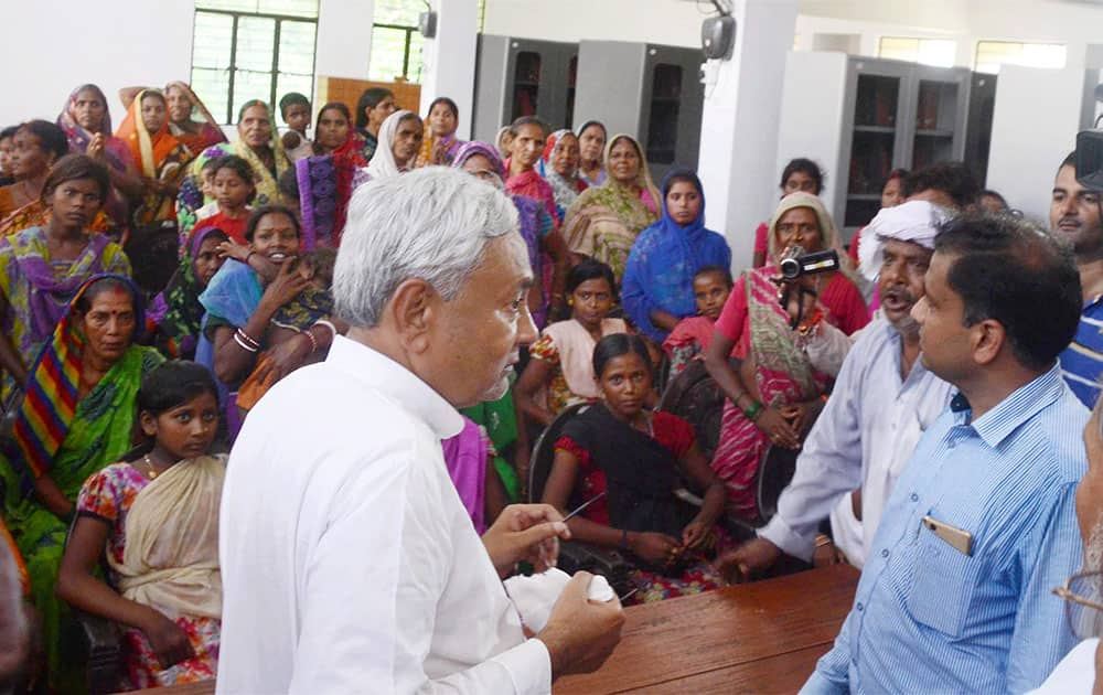 Bihar Chief Minister Nitish Kumar meeting with flood victims at Bihar Vidyapith in Patna