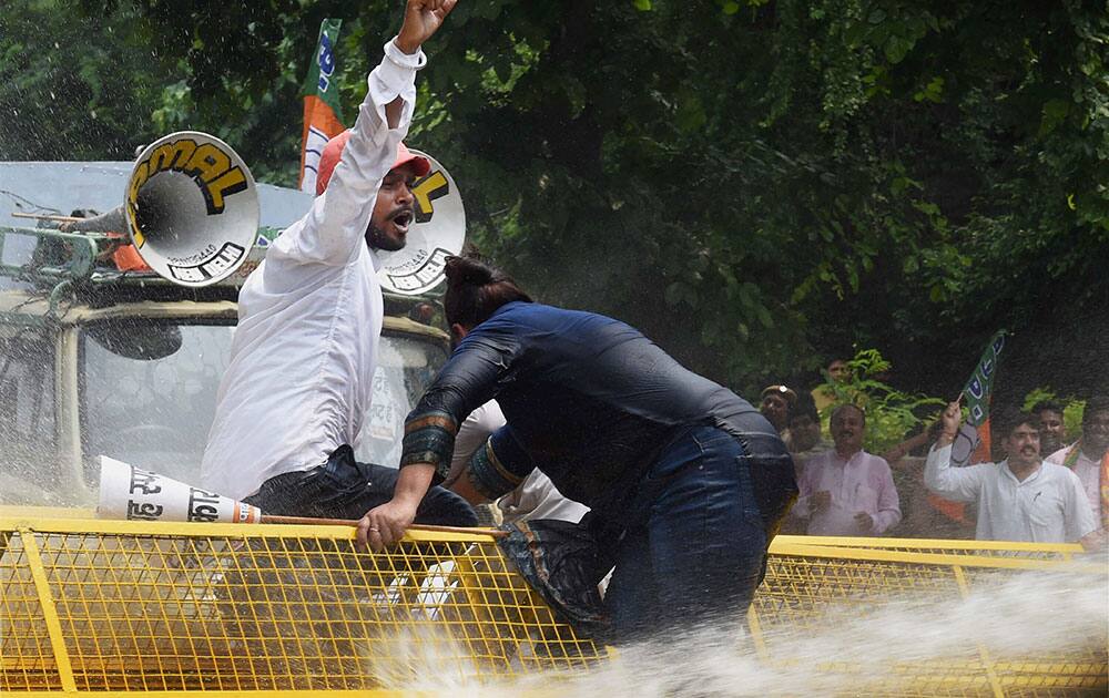 Delhi BJP members protest against Delhi Chief Minister Arvind Kejriwals government at Vidhan Sabha in New Delhi