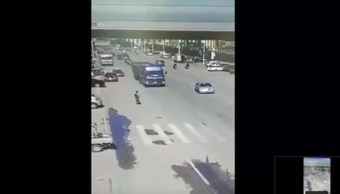 Shocking! China man jumps underneath moving truck in dramatic video – Watch what happens next