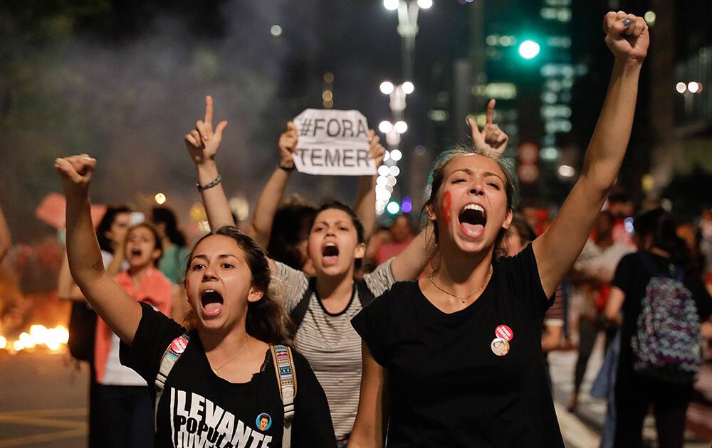 Demonstrators shout slogans against acting Brazils President Michel Temer during a rally in support of Brazils suspended President Dilma Rousseff in Sao Paulo, Brazil Demonstrators shout slogans against acting Brazils President Michel Temer during a rally in support of Brazils suspended President Dilma Rousseff in Sao Paulo, Brazil